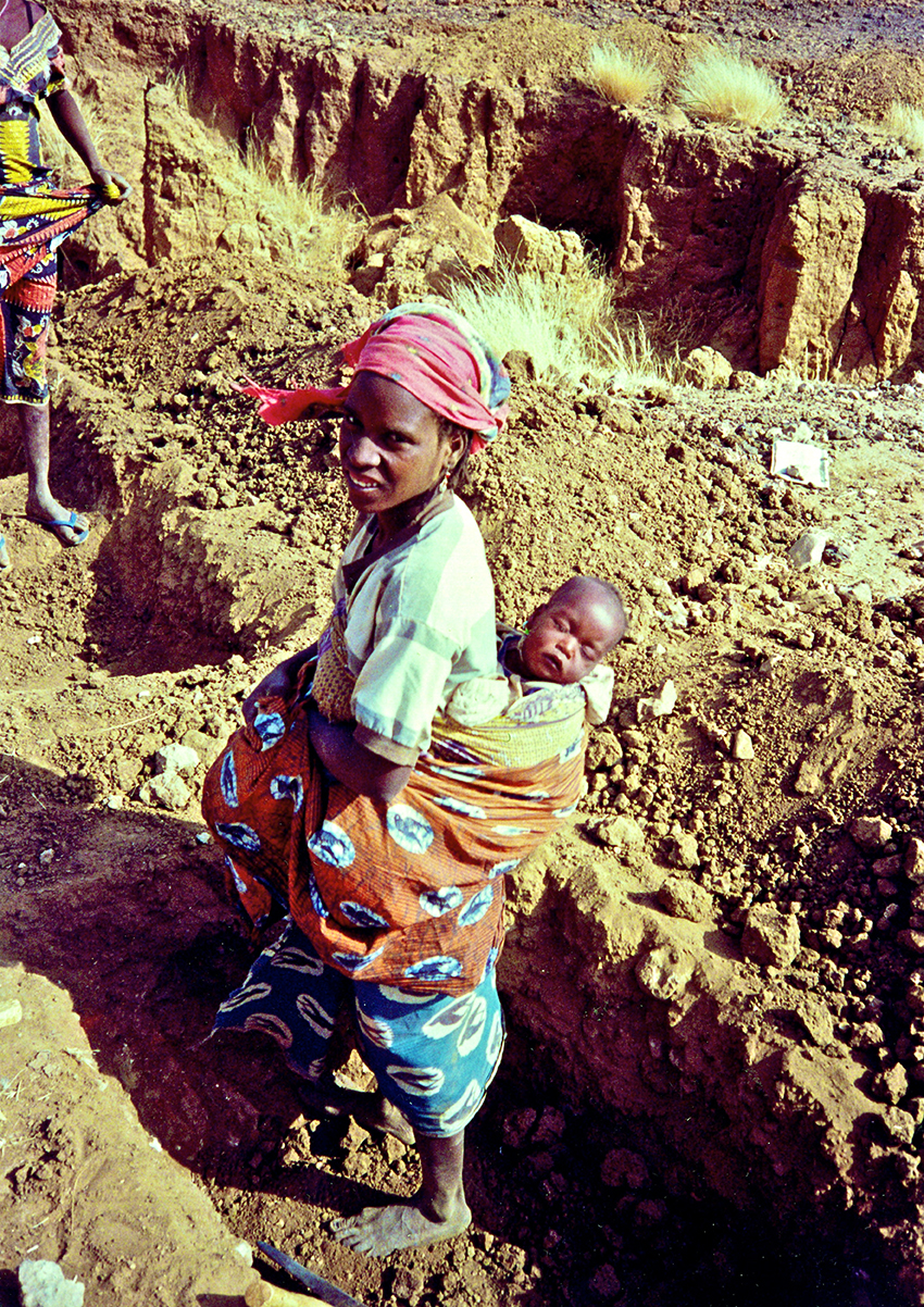 2 Woman working in reforestation trench for project klein