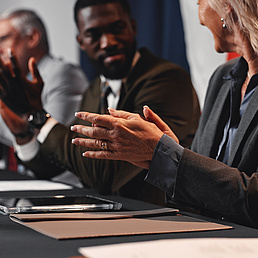Press conference, applause and hands with group for delegation, international government and panel. Summit, people and politician at speech for diplomacy discussion, global forum or policy update