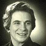 Portrait of Hulde Levi. She has short hair, smiles to the side and wears a black dress.